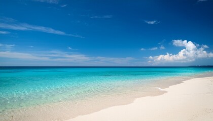 relaxing beach sand landscape with tranquil turquoise water under a bright blue sky