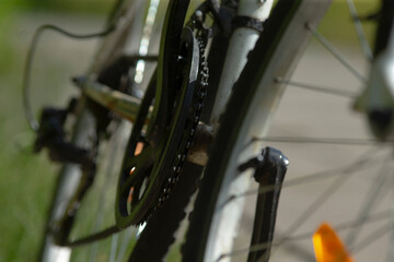 This image shows a detailed closeup view of a bicycle that features a bright yellow fender, emphasizing its vibrant design and components