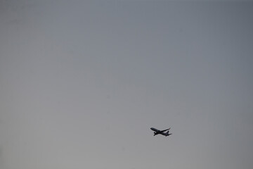A small aircraft is soaring through a cloudy sky filled with numerous clouds and atmospheric phenomena that can be observed during flight