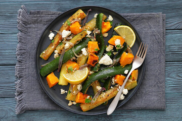 roasted vegetable salad with goat cheese on plate