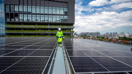 Workers install solar panels on building rooftop in urban area during bright day