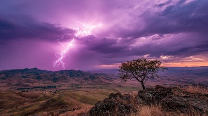   A tree on a hill under a purple sky with lightning bolt above valley and mountains