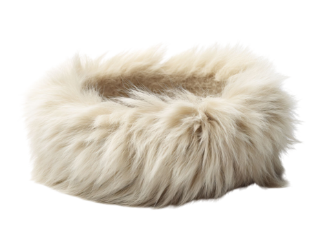PNG of Cozy, fluffy pet bed in soft cream color, perfect for a snug nap.