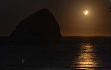 moon rises over the sea