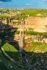 Beautiful view of the Itlyatlyar Waterfall falling from the edge of the steep wall of the deep...
