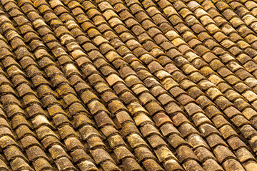 orange and brown old tile roof texture background. Old vintage roof tiles backdrop for concept and design.