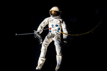 The Deutsches Museum in Munich features an astronaut dummy in a spacesuit. The astronaut is using a...