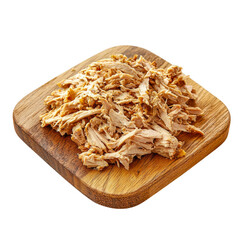 Pulled chicken breast on wooden cutting board