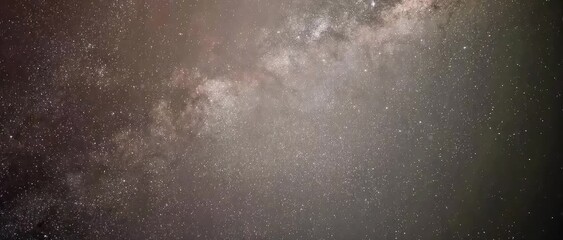 Beautiful night sky time lapse with Milky Way galaxy on dark sky. Starry night background. Galaxy exploration through outer space towards glowing milky way galaxy. . High quality 4k footage - Powered by Adobe