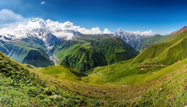 panoramic view of majestic mountains with lush green hills rugged terrain and distant snow capped peaks under a clear blue sky with scattered clouds gudauri caucasus mountains georgia