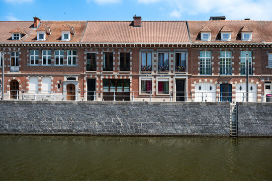 Historical houses at the banks of the river Scheldt in the old town of Tournai, Hainaut, Belgium