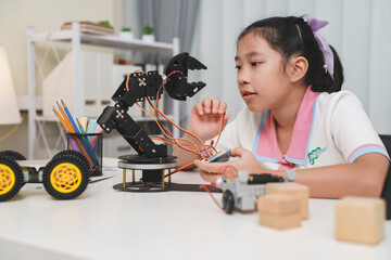 Creative kid assembling a DIY robot, representing future innovation.