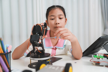STEM education: A girl learning engineering and mechanics.