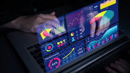 A sleek laptop displays advanced data visualization with colorful graphs and charts analyzing business performance for effective decision-making. Impute