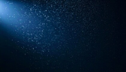 Fototapeta premium Floating dust particles illuminated by a single cinematic beam of light on a dark gradient background