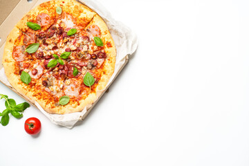 Pizza Margarita in a cardboard box on white background.