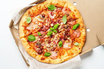 Pizza Margarita in a cardboard box on white background.