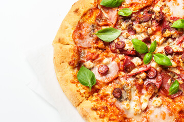 Delicious meat pizza with ham, salami and sausages.