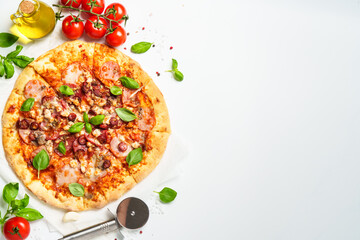 Delicious meat pizza with ham, salami and sausages.