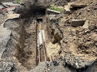 deep trench old leaky working water pipe. repair and replacement of city and underground utilities.