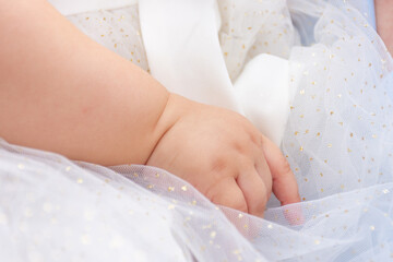 Close-up of baby girl hand.