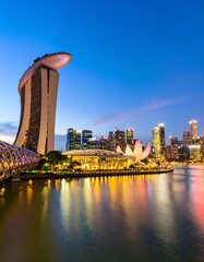 City skyline at dusk reflecting on water