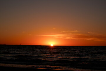 Low orange sunset with warm sky