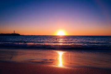 Fototapeta premium Beach sunset with colorful sky