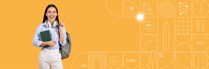 A motivated student smiles while holding a notebook and laptop. She wears headphones and stands confidently against a vibrant painted backdrop, ready for her studies.