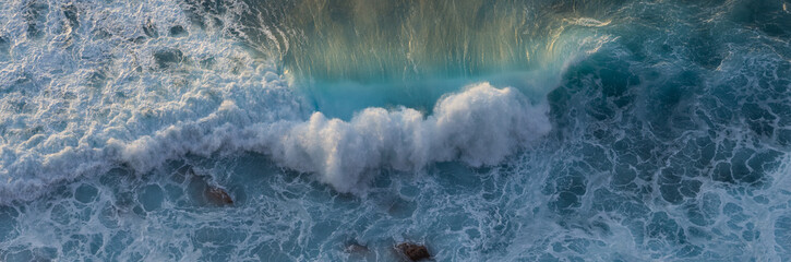 Blue ocean wave on yellow sandy beach. Sea waves and sand the summer background. Summer seascape...