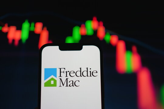 Roosendaal, The Netherlands - August 05, 2025: A mobile phone displaying the company logo of Freddie Mac, with a stock chart in the background.