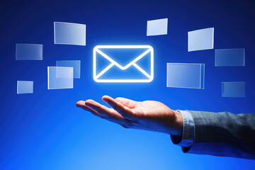 Digital Communication Concept A Hand Presenting a Glowing Email Icon Surrounded by Floating Rectangles, Symbolizing the Ubiquity and Importance of Electronic Messaging