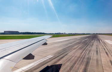 Fototapeta premium View from the airplane window during takeoff at Sheremetyevo airport at summer