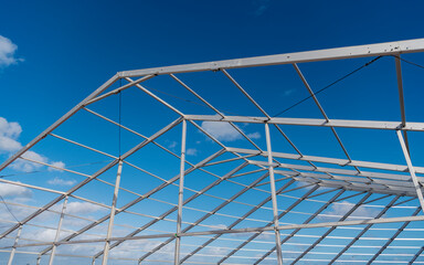 Fototapeta premium Structure engineering at building site. Framework construction architecture. Architectural detail. Installation of metal structure. Metal construction backdrop. Structural engineering