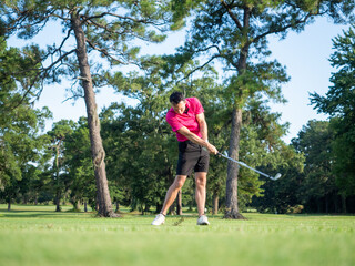 Male Golfer Chipping Follow Through Swing - Front View