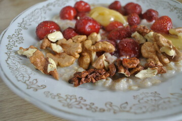 plate of oatmeal nuts and berries