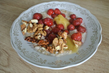 plate of oatmeal nuts and berries