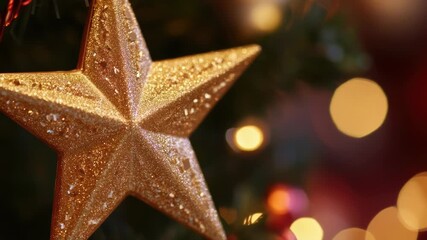 A gold star ornament hangs from a Christmas tree branch - Powered by Adobe