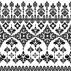 Obraz premium Bold and sophisticated, this black and white Damask pattern beauty of ornamental symmetry. The high contrast enhances its intricate floral and baroque motifs, making it perfect for interiors.