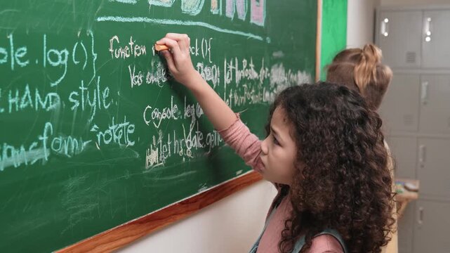 American student studying coding engineering prompt while writing answer on blackboard. Intelligence girl planning and learning about coding development plan. Successful child sharing idea. Pedagogy.