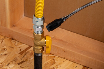 Checking natural gas or propane fitting with leak detector. Plumbing, home maintenance, natural gas...
