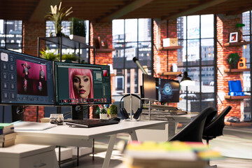 Organized creative workspace for graphic designers and photographers, featuring a dual monitor setup with digital editing tools. Photo editor software and AI chat bot for content creation.