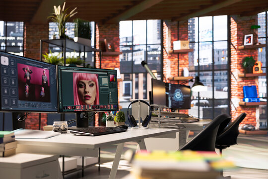 Organized creative workspace for graphic designers and photographers, featuring a dual monitor setup with digital editing tools. Photo editor software and AI chat bot for content creation.