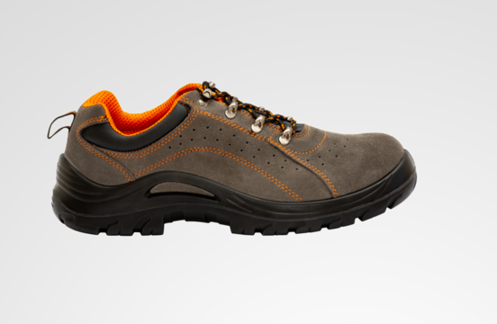 Creative collage composition of protective footwear on an isolated gray background with space for text. Work boots for men in factories or industry to protect feet from accidents.