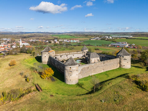 Aerial view of the medieval Bzov&Atilde;&shy;k Monastery stands in stark contrast to the modern village beyond, a testament to time's passage, Bzov&Atilde;&shy;k, Krupina, Slovakia.