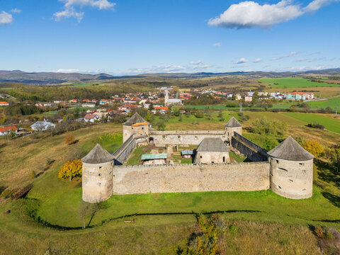 Aerial view of the imposing Bzov&Atilde;&shy;k Monastery stands guard with its stone walls and cylindrical towers, amidst the vast green landscape, Bzov&Atilde;&shy;k, Krupina.