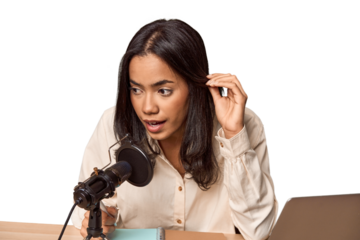 Filipino woman podcasting with mic and laptop