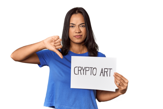 Woman with "crypto art" sign in studio showing a dislike gesture, thumbs down. Disagreement concept.