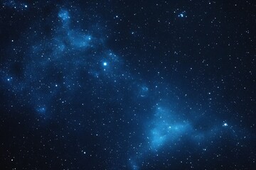 Obraz premium Starry sky background, blue night sky full of stars, glowing stars in the dark space, starry background, dark night, stars in the distance, starlight, dark background with a blue glow, night sky. 