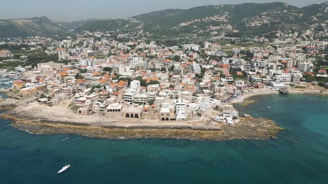 Aerial perspective of Batroun, a historic town nestled on Mediterranean shore in northern Lebanon. Panoramic view.